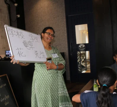 Saachi students participating in a Japanese language activity at a restaurant